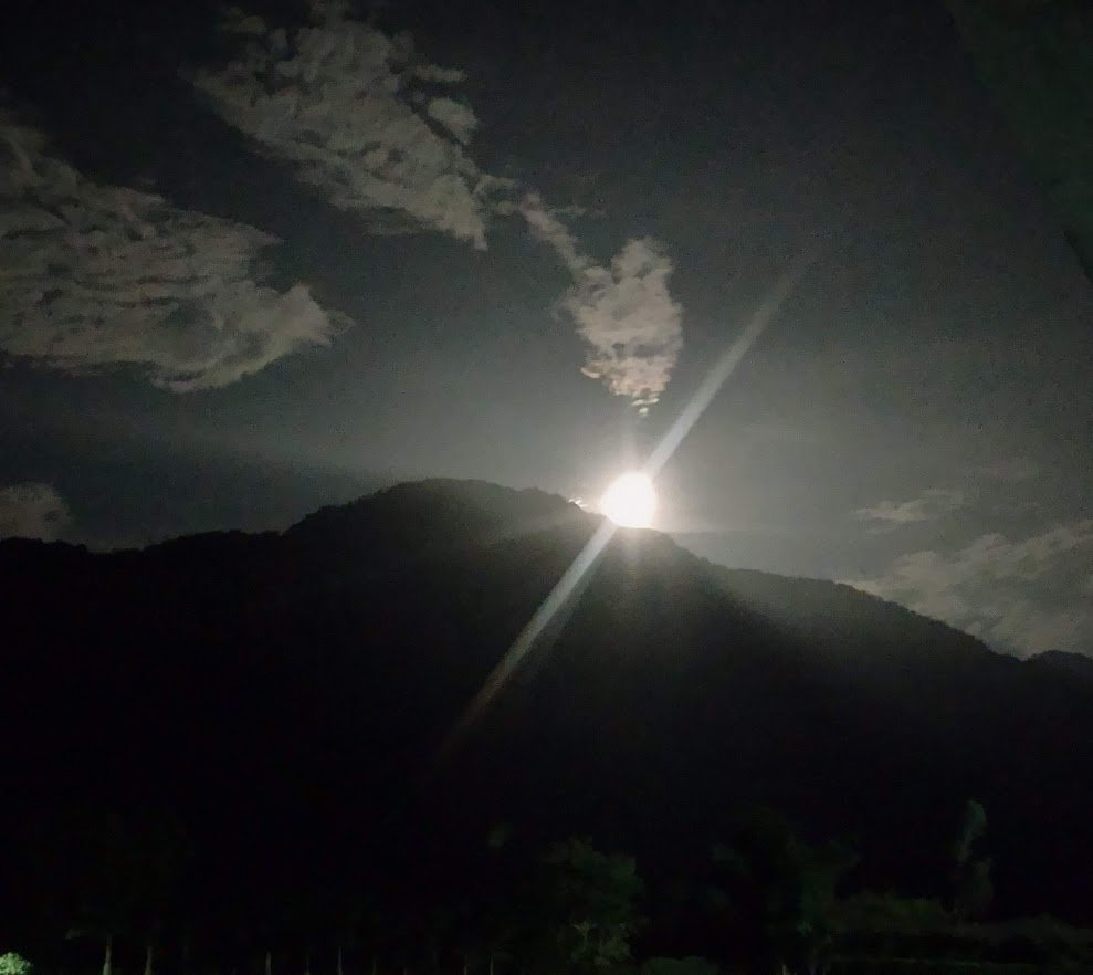 Moon appearing as a glowing orb of light