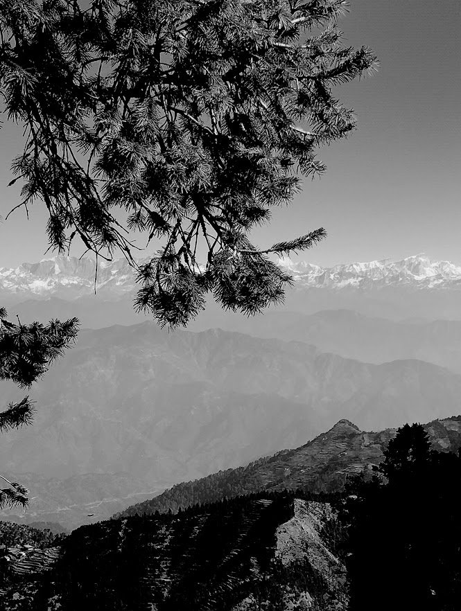 Monochrome image of snow clad mountains