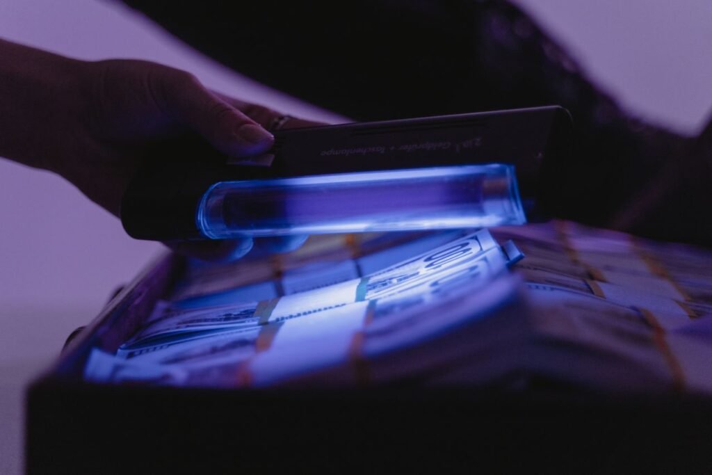 image showing currency under ultraviolet light by tima miroshnichenko 